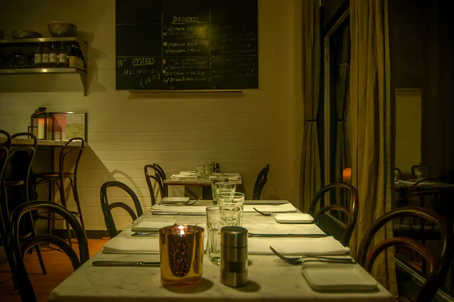 Tables along front window of restaurant - thumb